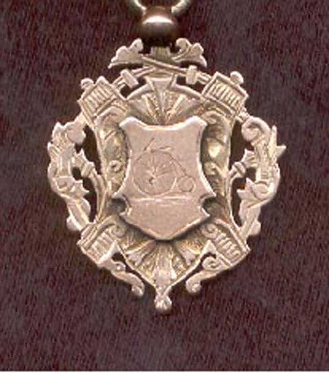 Second medallion shield with engraved Penny Farthing bicycle.jpg